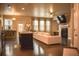 Open-concept space featuring hardwood floors, modern lighting, and a cozy stone fireplace at 1058 Mays Sw Hl, Atlanta, GA 30336