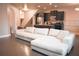 Inviting open-concept living area with a large sectional, hardwood floors, and eat-in kitchen at 1058 Mays Sw Hl, Atlanta, GA 30336
