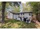 Backyard featuring a patio with outdoor furniture, a well-maintained lawn, and a privacy fence for secluded relaxation at 1089 Greenleaf Se Rd, Atlanta, GA 30316