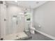 Modern bathroom featuring a tiled walk-in shower with glass door, neutral paint and fixtures at 1089 Greenleaf Se Rd, Atlanta, GA 30316