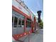 Charming commercial building with red and white accents, featuring large windows and inviting signage, capturing a modern urban aesthetic at 1089 Greenleaf Se Rd, Atlanta, GA 30316