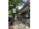 Sidewalk view of East Atlanta storefront with large windows, patio seating, and a banner ad on a lamp post at 1089 Greenleaf Se Rd, Atlanta, GA 30316