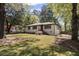 Charming single-story home showcasing an inviting front yard with stone walkway at 1089 Greenleaf Se Rd, Atlanta, GA 30316