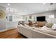 Open-concept living space features hardwood floors and seamlessly connects to the dining area at 1089 Greenleaf Se Rd, Atlanta, GA 30316