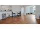 Charming dining room and kitchen area featuring hardwood floors, and modern lighting fixture at 1535 Duluth Hwy # 1104, Lawrenceville, GA 30043