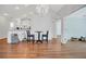 Charming dining room and kitchen area featuring hardwood floors, and modern lighting fixture at 1535 Duluth Hwy # 1104, Lawrenceville, GA 30043