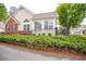 Beautiful home featuring a landscaped front yard, black metal fence, and manicured bushes at 1535 Duluth Hwy # 1104, Lawrenceville, GA 30043