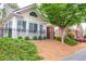 Beautiful home featuring a landscaped front yard, black metal fence, and manicured bushes at 1535 Duluth Hwy # 1104, Lawrenceville, GA 30043