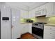 Kitchen features stainless steel appliances and white cabinetry at 1535 Duluth Hwy # 1104, Lawrenceville, GA 30043