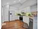 Eat-in kitchen features modern stainless steel appliances and white cabinetry at 1535 Duluth Hwy # 1104, Lawrenceville, GA 30043