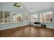 Bright living room boasts vaulted ceilings, many windows, and beautiful hardwood floors at 1535 Duluth Hwy # 1104, Lawrenceville, GA 30043