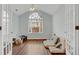 This spacious living room has a large window that allows plenty of natural light and laminate wood flooring at 1535 Duluth Hwy # 1104, Lawrenceville, GA 30043