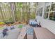 Large backyard with a hot tub and a gravel area with adirondack chairs surrounding a fire pit at 657 Swans Landing Dr, Dacula, GA 30019