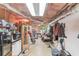 Basement with exposed ceiling, laundry area, storage, and exercise equipment at 657 Swans Landing Dr, Dacula, GA 30019