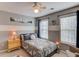 Comfortable bedroom with baseball decor, ceiling fan, and natural light at 657 Swans Landing Dr, Dacula, GA 30019