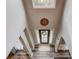 Bright foyer with skylight, contemporary light fixture, and hard wood style floors at 657 Swans Landing Dr, Dacula, GA 30019