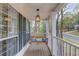 Relaxing covered porch with a swing, perfect for enjoying the outdoors and neighborhood views at 657 Swans Landing Dr, Dacula, GA 30019