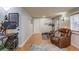 An open and airy home office featuring a desk, chair, entertainment center, and workout equipment at 657 Swans Landing Dr, Dacula, GA 30019