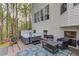 Backyard with a hot tub, patio furniture, and a view of the surrounding nature at 657 Swans Landing Dr, Dacula, GA 30019