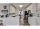 Stylish kitchen featuring white cabinets, quartz countertops, and stainless steel appliances for culinary enthusiasts at 657 Swans Landing Dr, Dacula, GA 30019