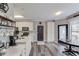 Modern kitchen with stainless steel appliances, a breakfast bar, and ample counter space at 657 Swans Landing Dr, Dacula, GA 30019