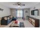 This cozy living room features a comfortable couch, flatscreen television, and decor at 657 Swans Landing Dr, Dacula, GA 30019
