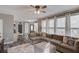 Bright and airy living room features large windows and ample seating for comfortable gatherings at 657 Swans Landing Dr, Dacula, GA 30019