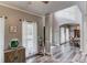 Open-concept living area with laminate floors, neutral paint, and seamless flow into other spaces at 657 Swans Landing Dr, Dacula, GA 30019