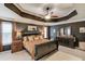Spacious main bedroom features a tray ceiling, neutral decor, and natural light at 657 Swans Landing Dr, Dacula, GA 30019