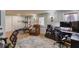 A spacious home office with a comfortable leather recliner, desk, office chair, and exercise equipment at 657 Swans Landing Dr, Dacula, GA 30019