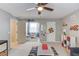 This playroom features room for playing, reading, and a view to the outdoors at 657 Swans Landing Dr, Dacula, GA 30019