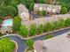 Aerial view of townhome community with manicured lawns, sidewalks, and community pool at 1012 E Paces Chase, Atlanta, GA 30326