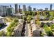 Beautiful aerial view of townhome community with mature trees and skyline in the background at 1012 E Paces Chase, Atlanta, GA 30326
