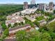 Stunning aerial view of townhomes and lush landscaping with a city skyline backdrop at 1012 E Paces Chase, Atlanta, GA 30326
