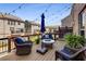 Beautiful outdoor deck area with comfortable seating, umbrella, and string lights at 1012 E Paces Chase, Atlanta, GA 30326