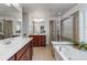 Spacious bathroom featuring double sinks, soaking tub, and separate shower at 1012 E Paces Chase, Atlanta, GA 30326