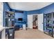 Stylish blue bedroom with a view of the staircase and featuring modern shelving units at 1012 E Paces Chase, Atlanta, GA 30326