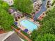 Aerial view of community pool, with ample seating and a bathhouse surrounded by lush landscaping at 1012 E Paces Chase, Atlanta, GA 30326