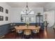 Elegant dining area with a stylish chandelier, wood table, and wainscoting detail at 1012 E Paces Chase, Atlanta, GA 30326