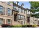 Charming townhome exterior with beautiful brick facade, shuttered windows, and a landscaped entrance at 1012 E Paces Chase, Atlanta, GA 30326
