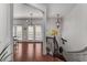 Bright foyer with hardwood floors, staircase with iron railing, and modern light fixtures at 1012 E Paces Chase, Atlanta, GA 30326