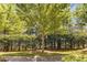 Charming front yard with mature trees and manicured landscaping at 1012 E Paces Chase, Atlanta, GA 30326