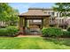 Gazebo in a common green area, with seating and manicured bushes at 1012 E Paces Chase, Atlanta, GA 30326