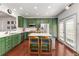 Beautiful kitchen with stainless steel appliances, custom green cabinets, and white countertops at 1012 E Paces Chase, Atlanta, GA 30326