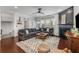 Spacious living room with a fireplace, large sectional sofa, and natural light at 1012 E Paces Chase, Atlanta, GA 30326