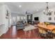 Bright living room with a fireplace, hardwood floors, and a cozy seating area at 1012 E Paces Chase, Atlanta, GA 30326