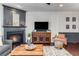 Cozy living room featuring a fireplace, wooden furniture, and decorative accents at 1012 E Paces Chase, Atlanta, GA 30326