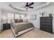 Calm main bedroom with tray ceiling, neutral color scheme, and ample natural light at 1012 E Paces Chase, Atlanta, GA 30326