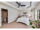 Well-lit bedroom features modern decor, including unique plants, a ceiling fan, and natural light at 1012 E Paces Chase, Atlanta, GA 30326