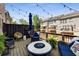 Relaxing patio space with comfy wicker furniture, string lights, and a pleasant view of the neighborhood at 1012 E Paces Chase, Atlanta, GA 30326